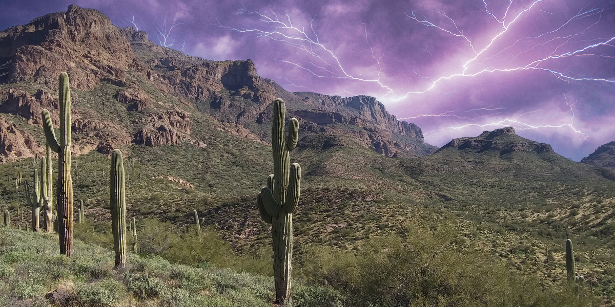 Desert landscape with lightning in sky
